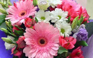 A bouquet of flowers with a gerbera